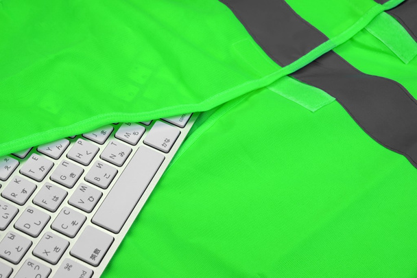 Keyboard In The Green Reflective Safety Vest - Φωτογραφία, εικόνα