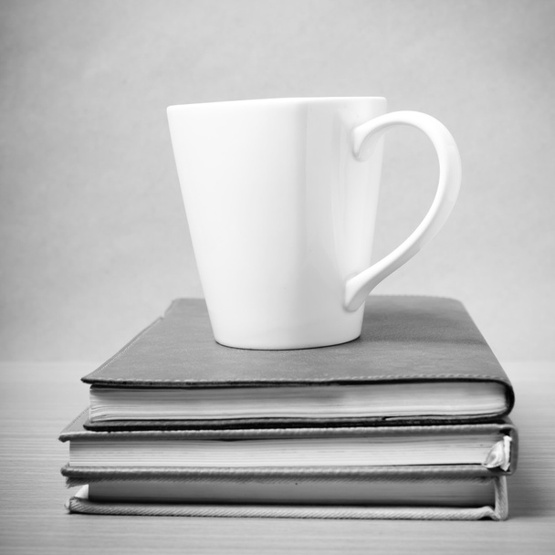 stack of book with coffee mug black and white tone style - Foto, imagen