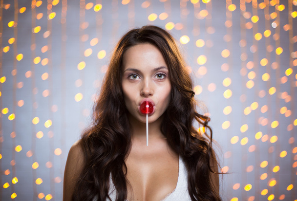 woman with lollipop on her lips - Fotografie, Obrázek