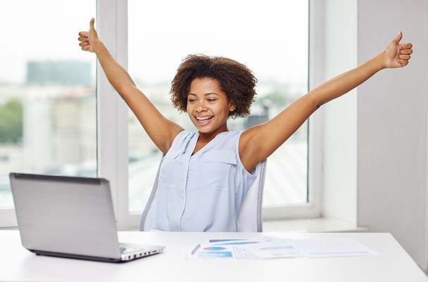 happy african woman with laptop at office - Photo, Image