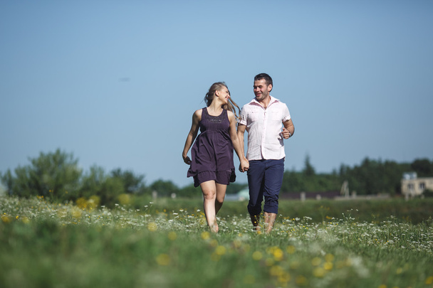 Couple running in field and have fun  - Foto, Imagem