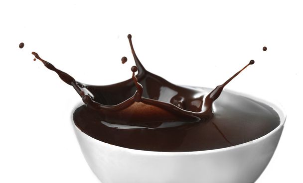 Splash of hot chocolate in cup - Foto, afbeelding