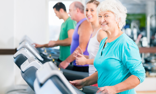 Group with senior people on treadmill in gym - Photo, Image