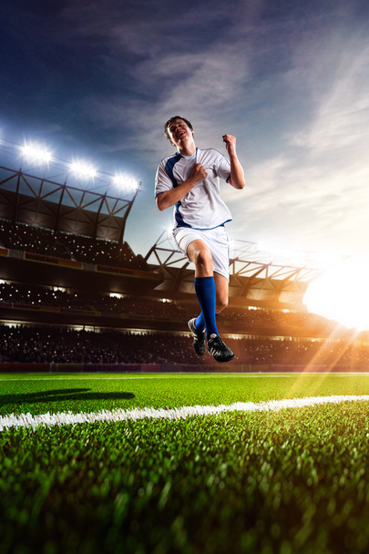 Soccer player in action sunset - Valokuva, kuva