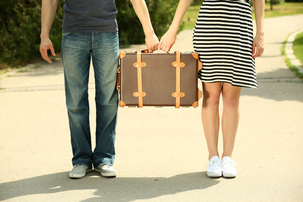 couple holding vintage suitcase - Photo, image