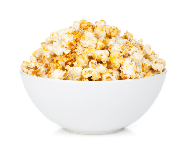 Bowl with popcorn on white background - Фото, зображення