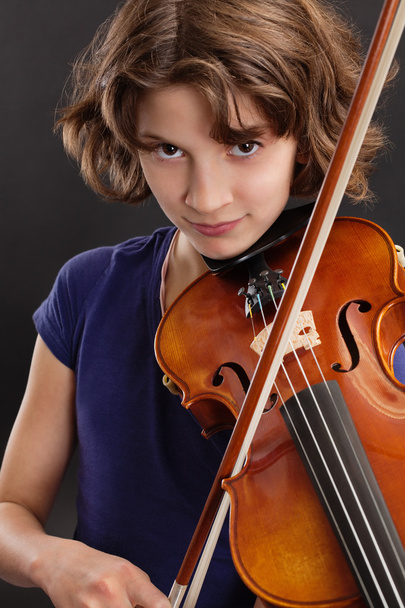 Young girl playing the violin - Fotó, kép