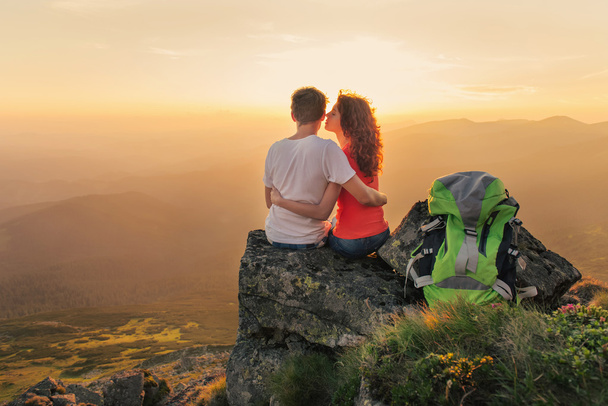 Happy couple enjoy beautiful view in the mountains - Photo, Image