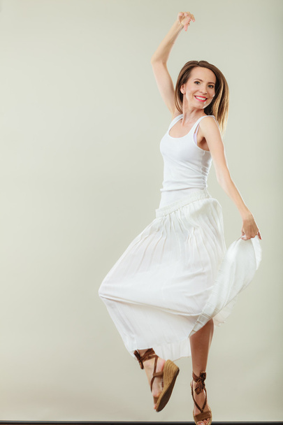 Woman in summer white dress jumping - Foto, Bild