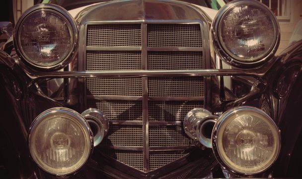 Front headlights and grille of a retro car, close up frontal (fr - Photo, Image