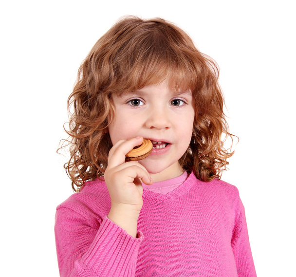 小さな女の子がケーキを食べる - 写真・画像