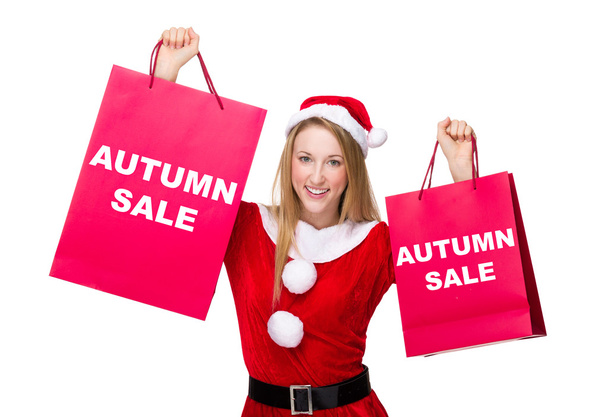Woman in christmas costume with shopping bags - Photo, Image