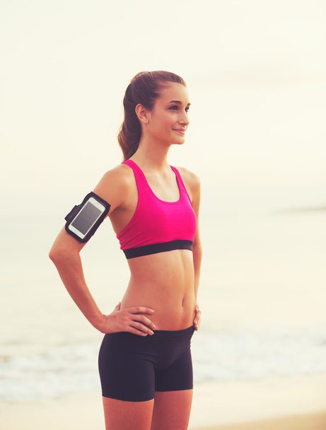 Young Healthy Fitness Woman with Smart Phone  - Foto, Bild
