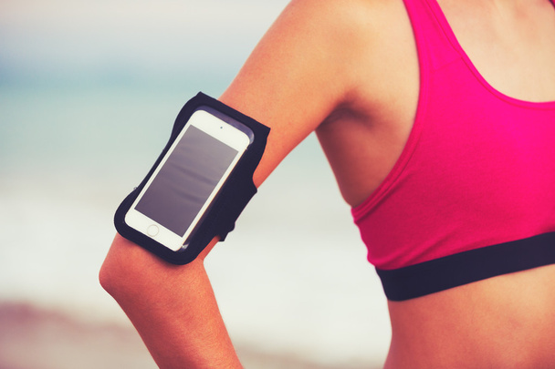 Young Healthy Fitness Woman with Smart Phone  - Foto, afbeelding