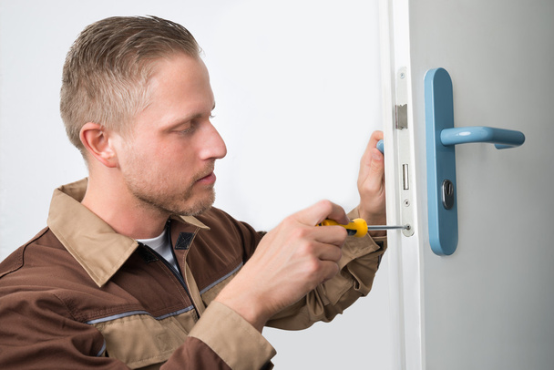 Carpenter Repairing Door Lock - Фото, изображение