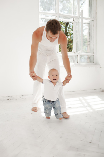 young father with his nine months old son at home - Fotografie, Obrázek