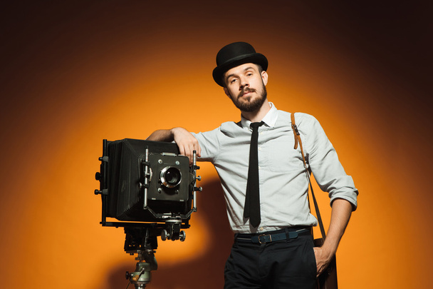 young man with retro camera  - Fotó, kép