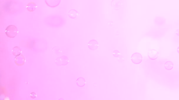 Burbujas de jabón sobre rosa claro, fondo
 - Metraje, vídeo