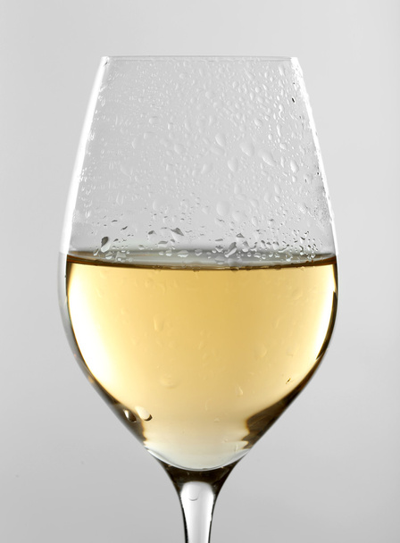 Glass of wine on grey background - Φωτογραφία, εικόνα