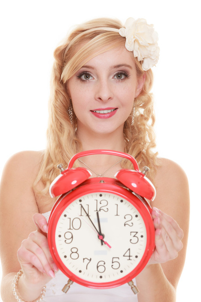 Bride holding  red alarm clock. - Foto, Bild
