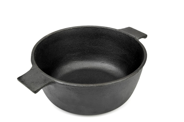 Вид на відкриту чавунну сковороду ізольовано
 - Фото, зображення