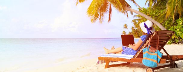 woman with laptop on tropical vacation, panorama - Photo, Image