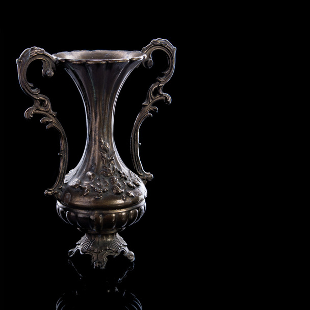 Old copper vase on a black background with reflection - Zdjęcie, obraz