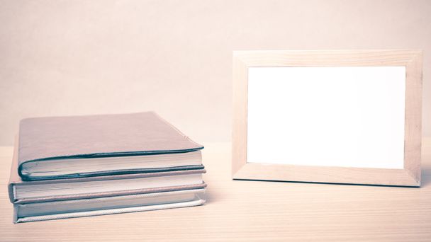 stack of book and photo frame vintage style - Фото, изображение