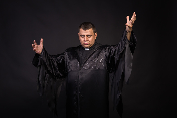 The actor plays the role of a priest - Photo, image