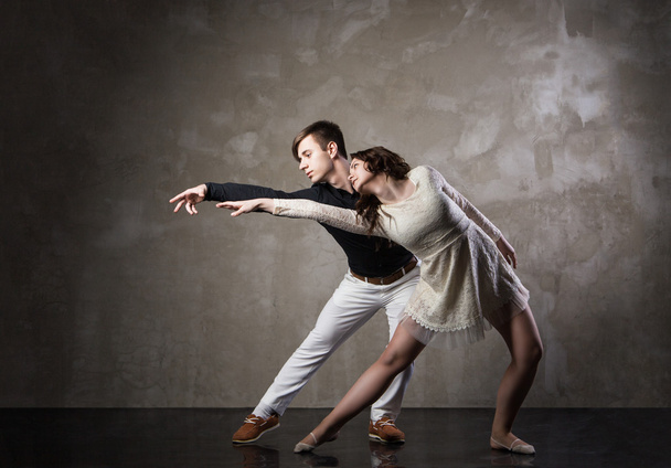 Beautiful couple in the active ballroom dance - Фото, изображение