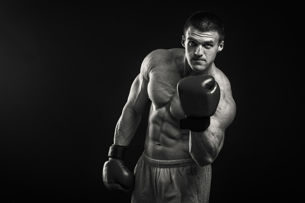 Athletic man in boxing gloves - Фото, зображення