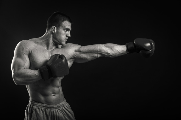 Athletic man in boxing gloves - Photo, Image