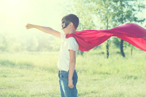 Little boy wearing superhero costume - Фото, изображение