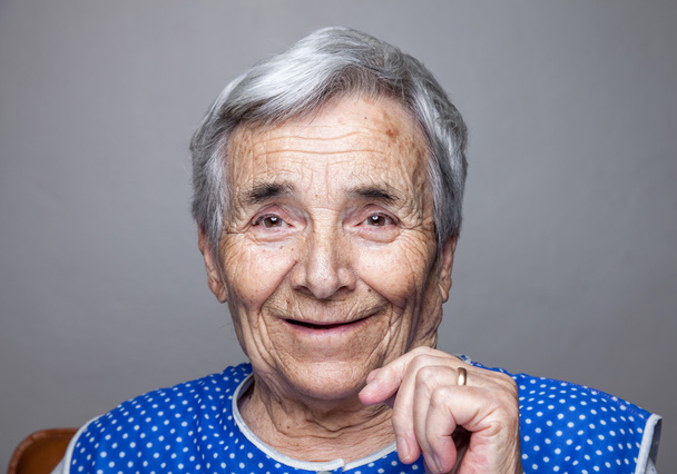 Portrait of an elderly woman - Фото, изображение
