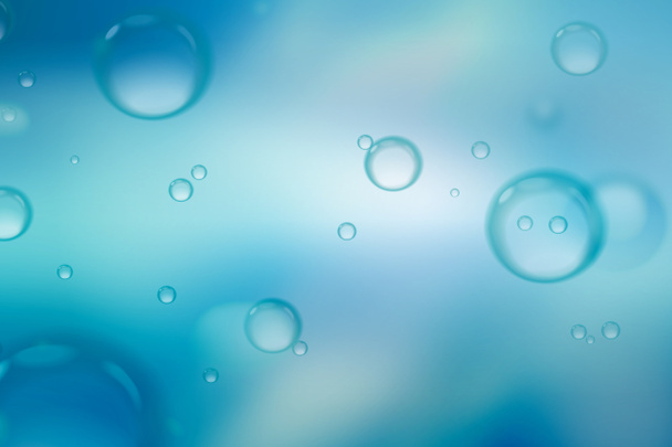 Soap bubbles on blue background, abstract background. - Photo, Image