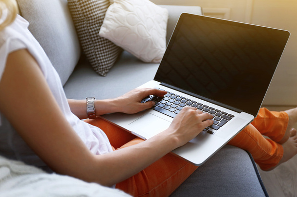 Woman using laptop, indoors - Fotografie, Obrázek