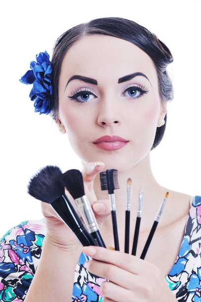 Beautiful young woman applying makeup - Φωτογραφία, εικόνα