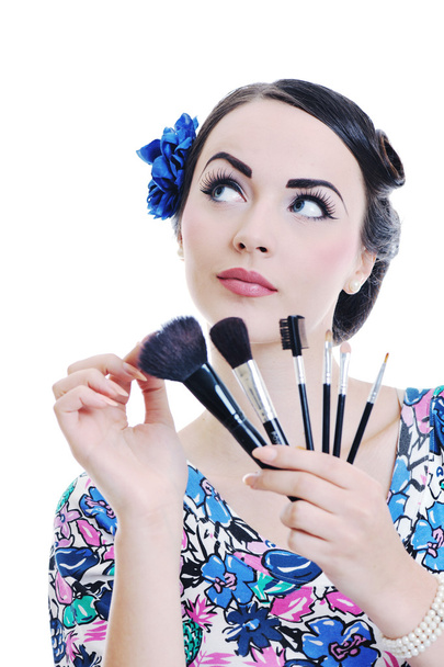 Beautiful young woman applying makeup - Фото, зображення