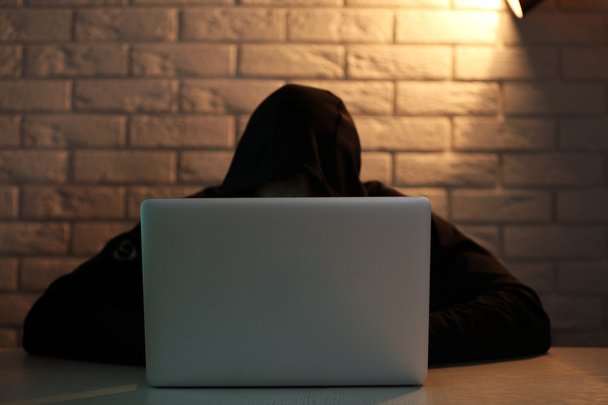 Hacker with laptop  - Фото, зображення