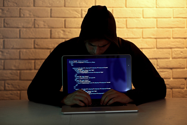 Hacker with laptop  - Zdjęcie, obraz