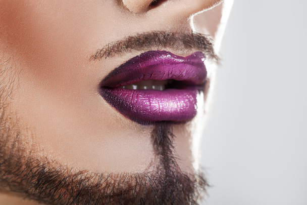 Closeup photo of bearded male lips with makeup - Foto, Imagem