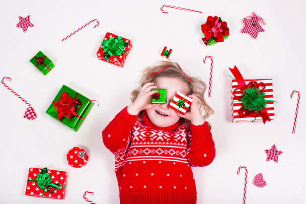 Little girl opening Christmas presents - Photo, Image