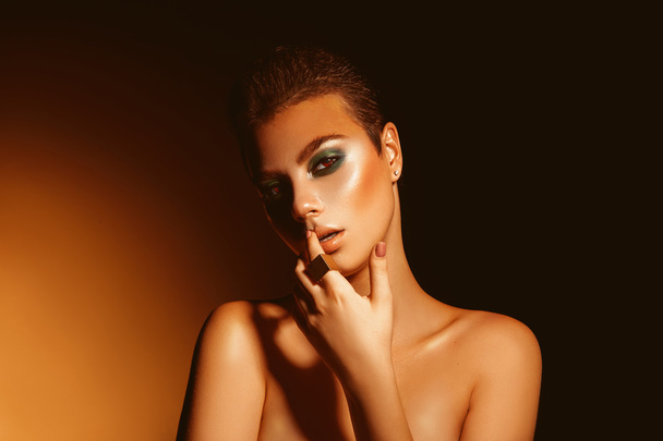 Sexy adult woman with professional green colors makeup and short - Zdjęcie, obraz