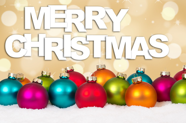 Merry Christmas many colorful balls golden background with snow - Photo, Image