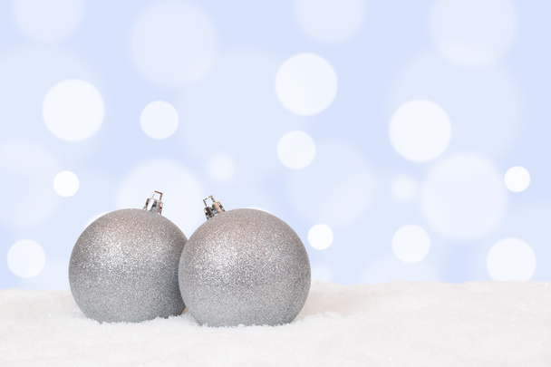Silver Christmas balls decoration with snow - 写真・画像