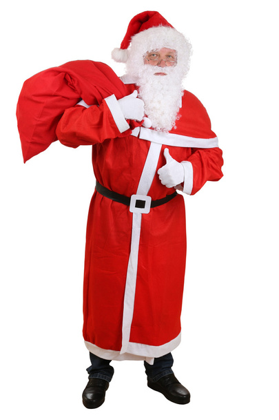 Санта-Клаус с сумкой для рождественских подарков показывает большие пальцы вверх
 - Фото, изображение