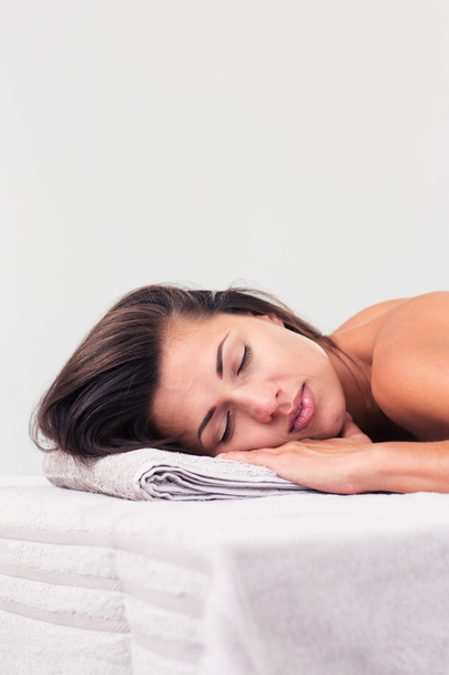 Beautiful woman sleeping on massage lounger - Foto, afbeelding