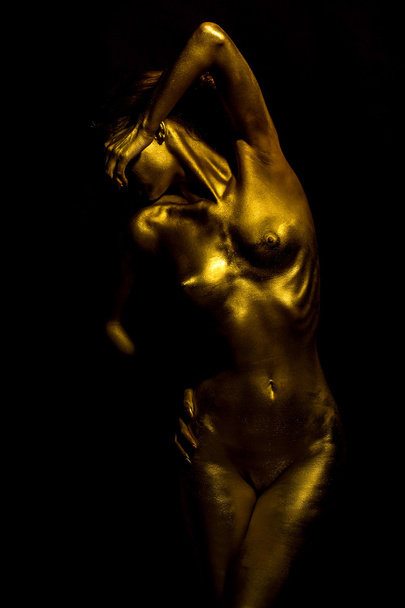 Sensual golden female body - Фото, изображение