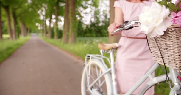 Mature woman riding vintage bicycle - Filmagem, Vídeo