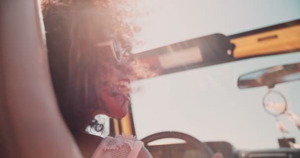 Afro girl on summer vacation road trip - Кадри, відео